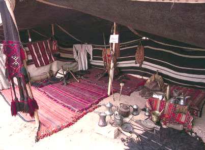 Bedouin tent support poles, divisions and carpets