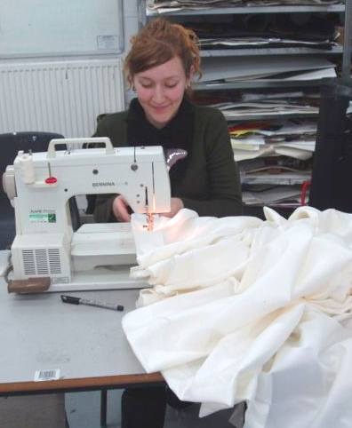Seamstress sewing curtains using a bernina machine
